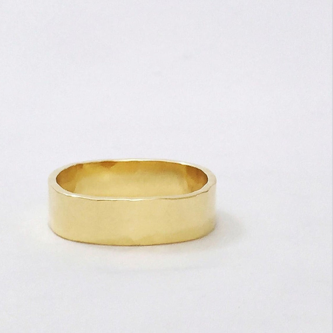 Gold ring on a white background